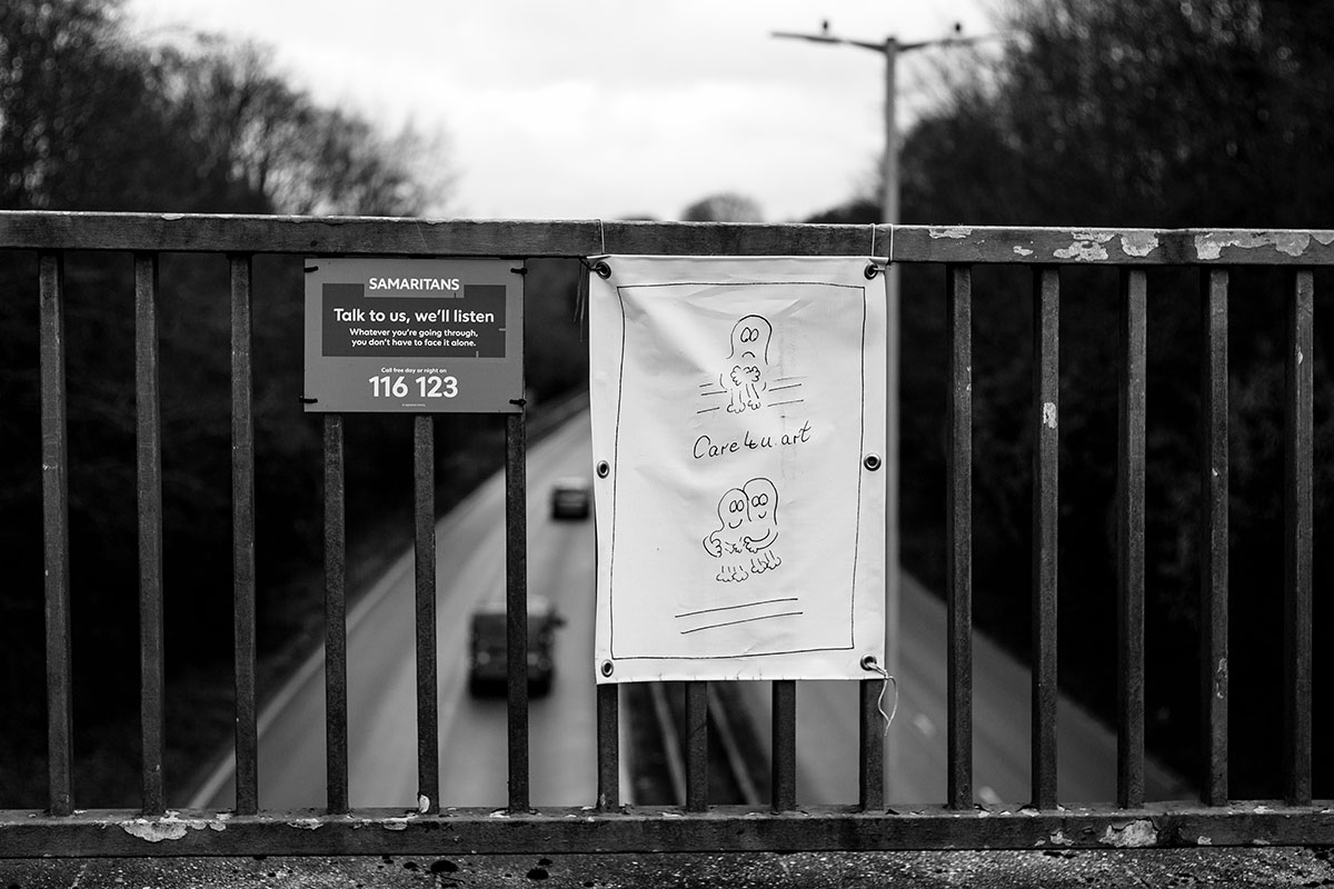 Samaritans messages over a bridge.