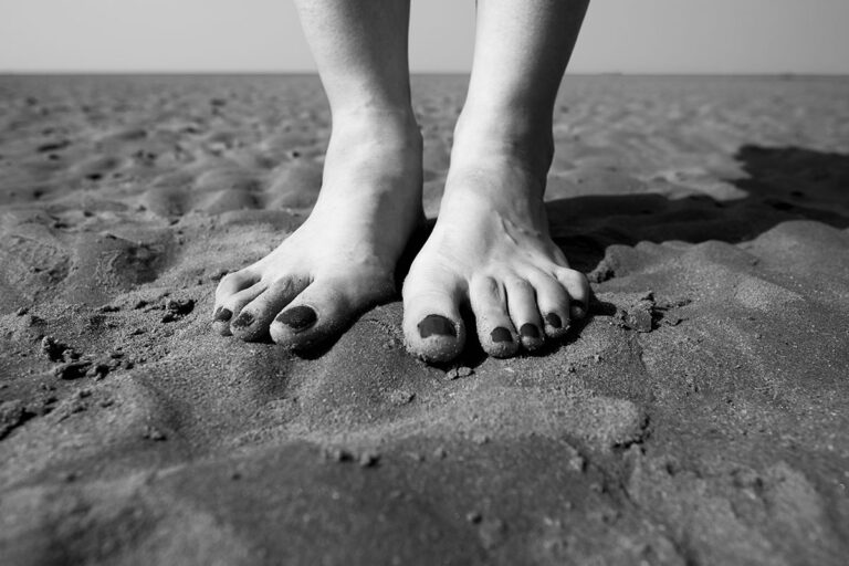 Stood barefoot on the beach with sand between your toes.
