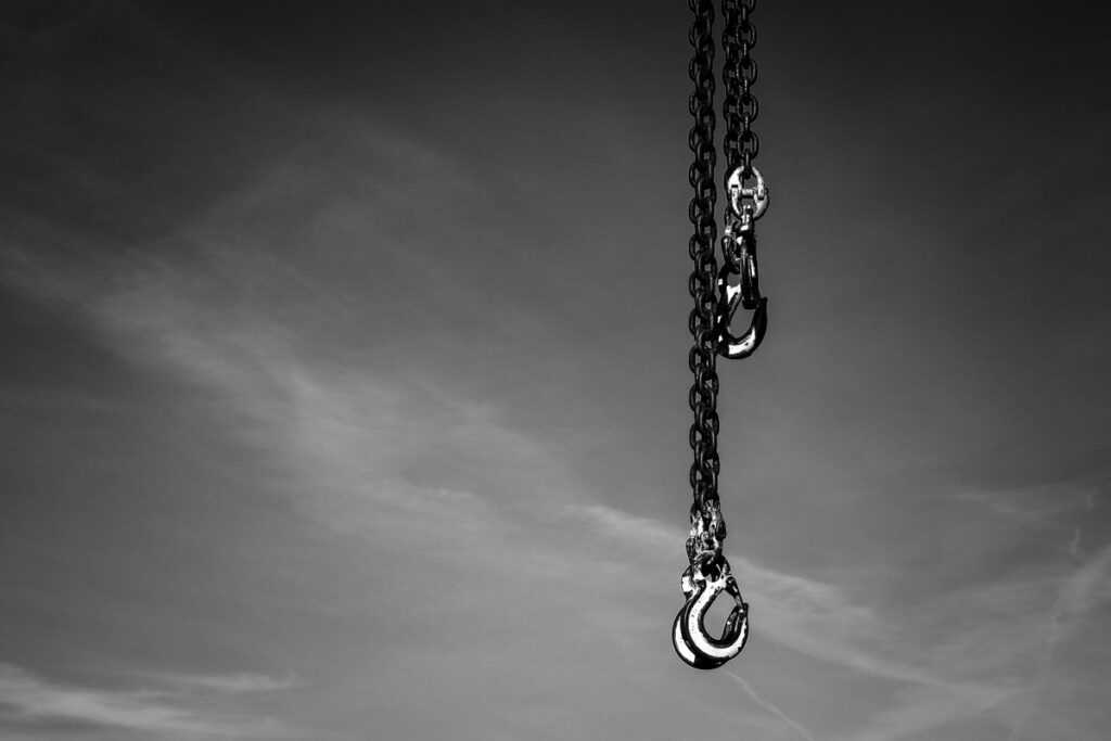 Industrial chains hanging down showing visual gravity.