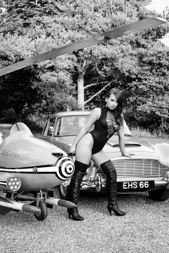 Glamour shot next to Little Nellie and an Aston Martin.