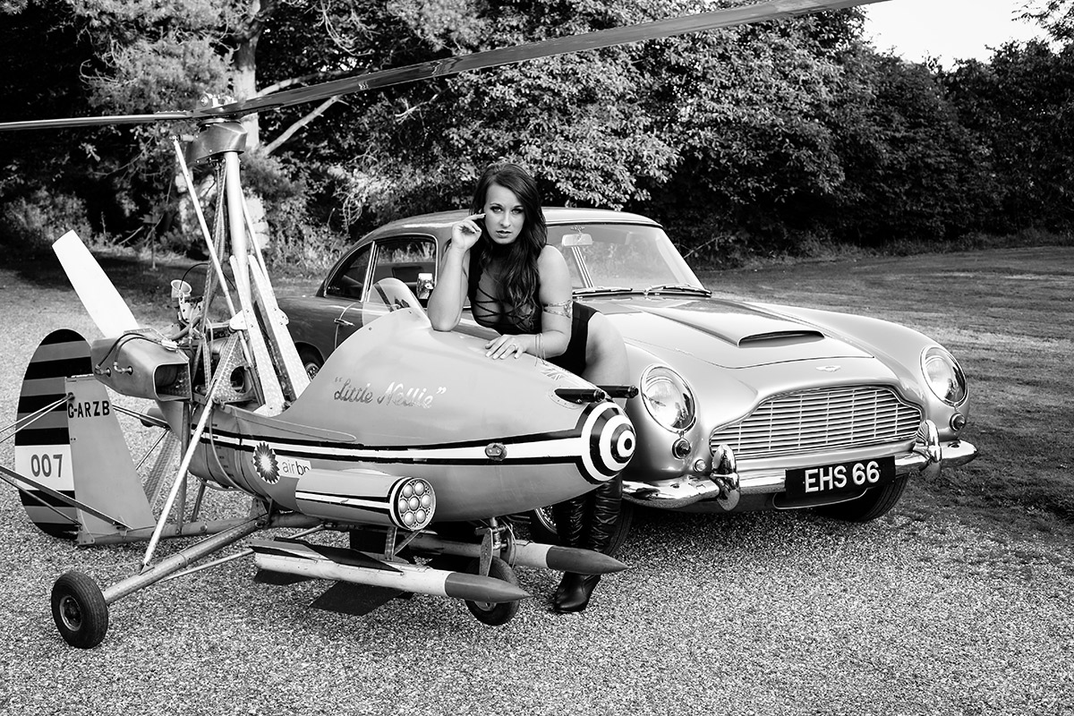 Model posing next to Little Nellie from the Bond Film.